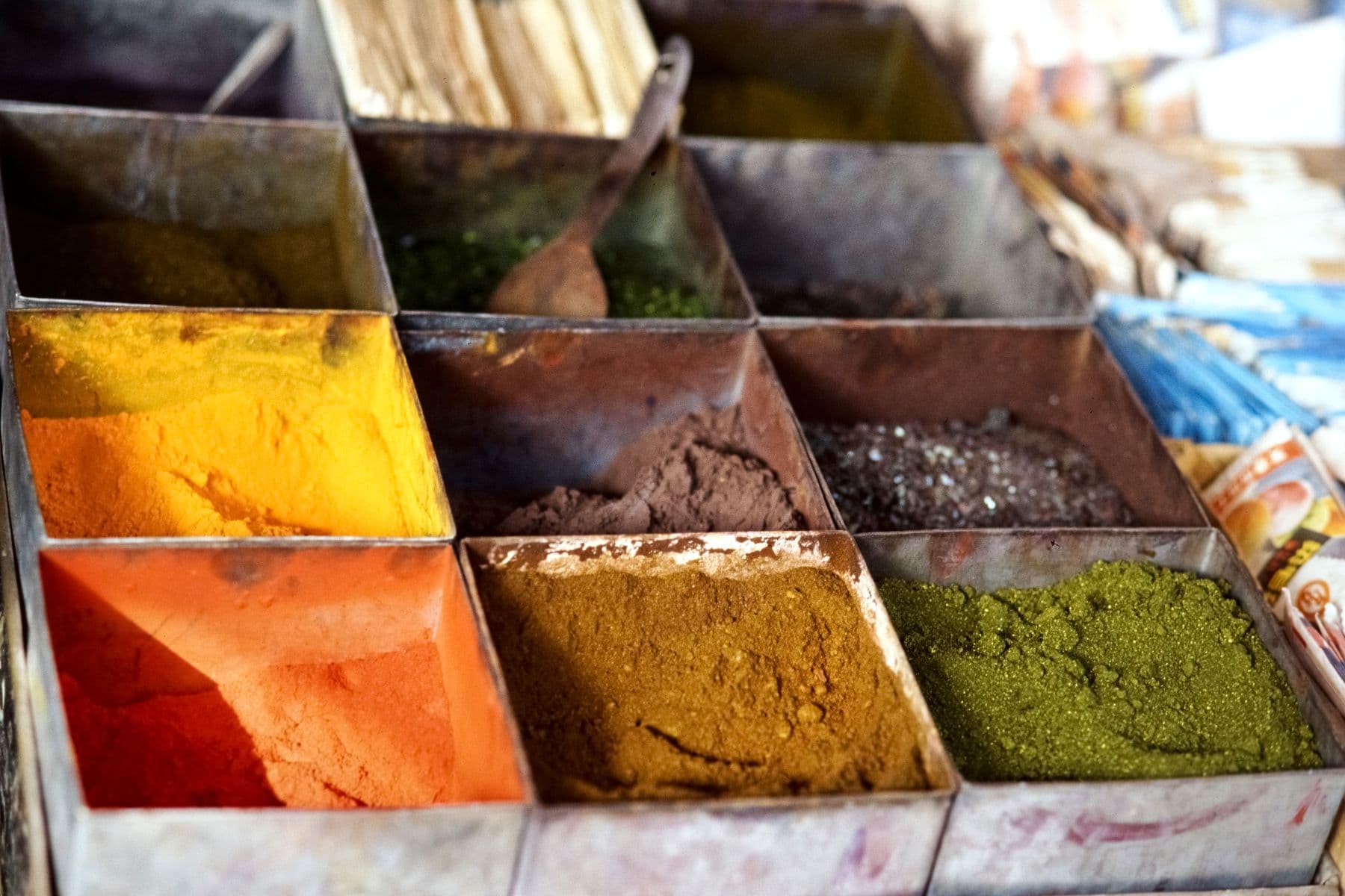 Trays of ground spice powders at an Indian sourcing market