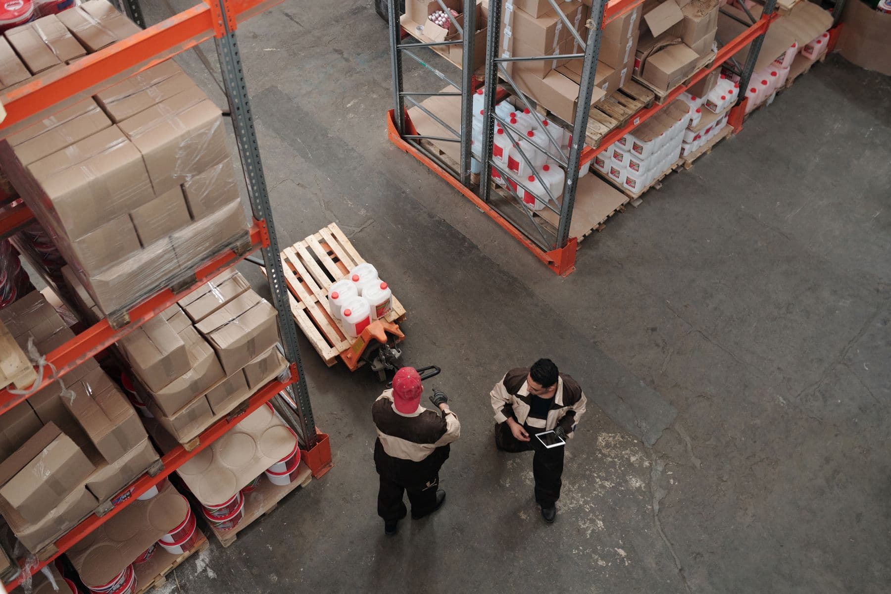 Palletised export cargo stacked in a warehouse ahead of container loading